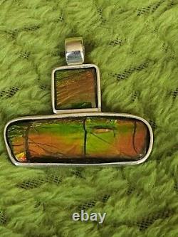 Custom made Sterling Silver Ammolite Pendant with 18 sterling. 925 snake chain