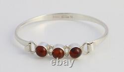 Danish sterling silver bangle designed and made by N. E. From and set with Amber