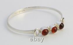 Danish sterling silver bangle designed and made by N. E. From and set with Amber