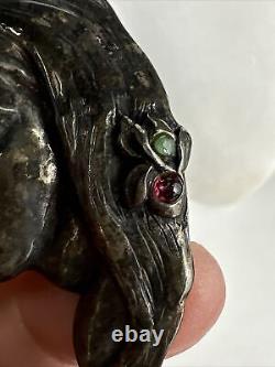 Gorgeous artisan made sterling silver Lady brooch with garnets and emeralds