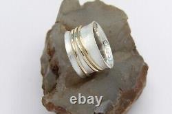 Hand made Solid. 925Sterling Silver and Solid 10K Yellow Gold Three Spinner Bands