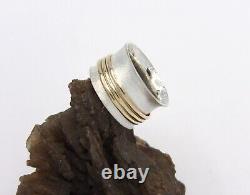 Hand made Solid. 925Sterling Silver and Solid 10K Yellow Gold Three Spinner Bands