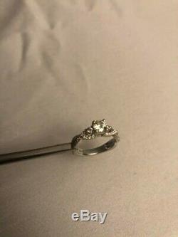 Long's custom made 3 stone engagement ring. With GIA Certification