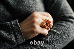 Unique flower Ring made of sterling silver and Baltic amber. Handmade