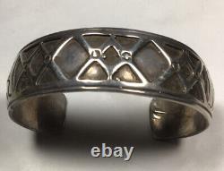 Vintage Navajo Made sterling silver Overlay cuff bracelet. X's And Spade Design